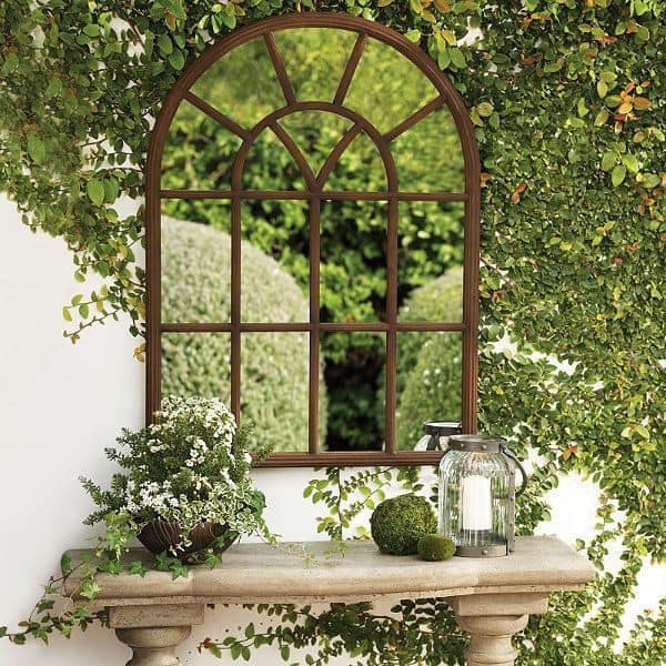Curved garden window with greenery