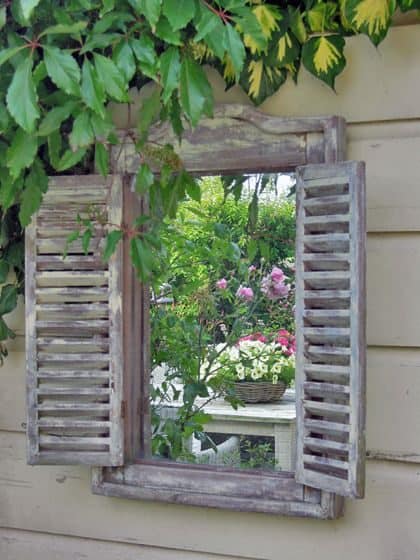 Garden mirror with shutters