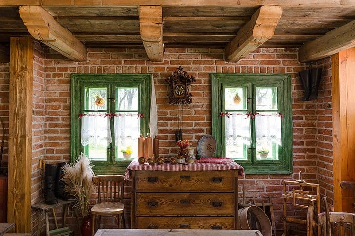 Country cottage shed interior, featuring a brick wall