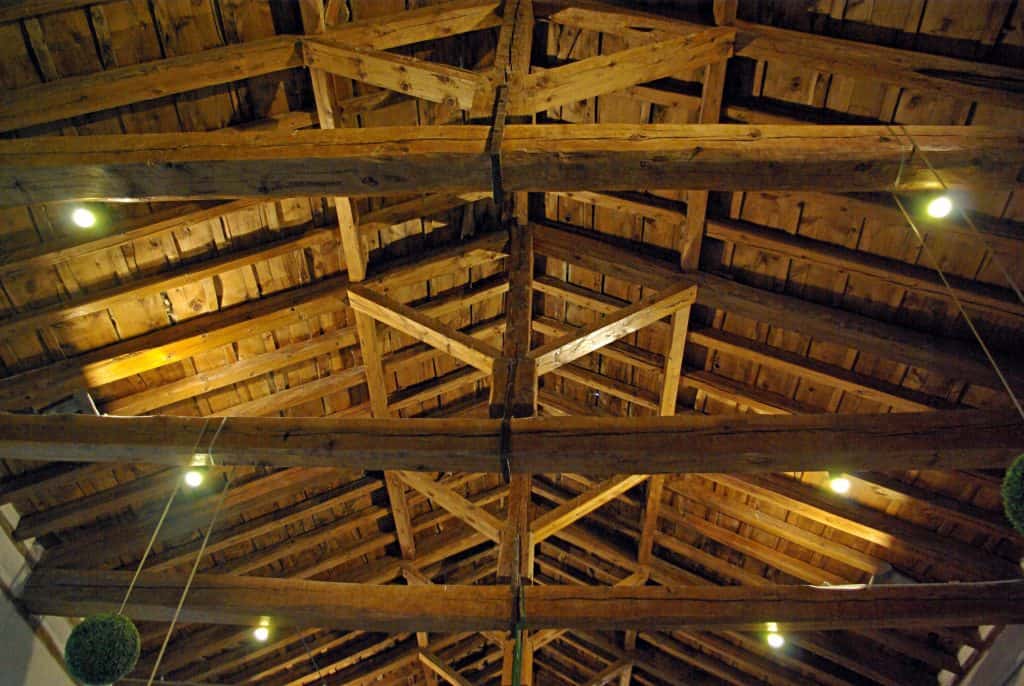 Wooden shed ceiling with lights on