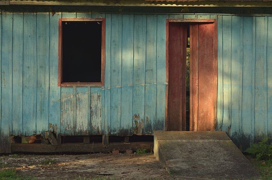 Old wooden shed structure painted in blue