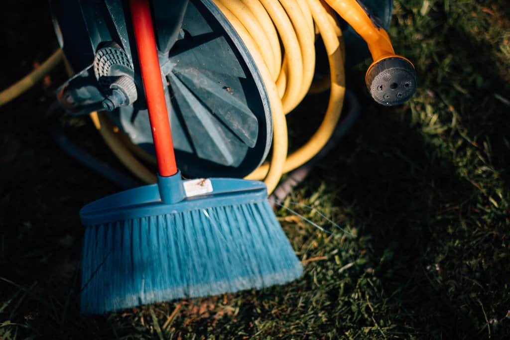 Broom and a garden hose