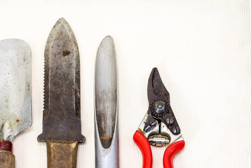 Various gardening tools with a garden knife