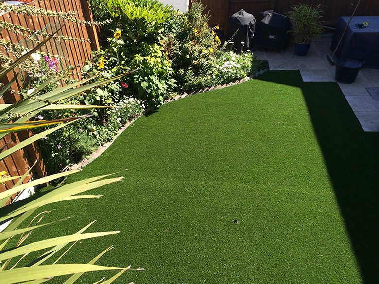 Backyard with artificial lawn