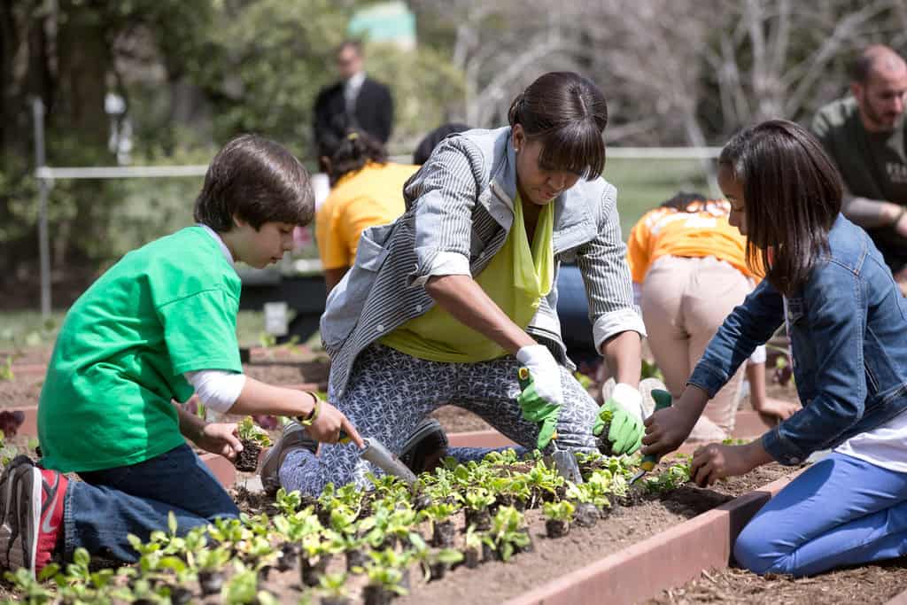 First Lady Michelle Obama and students spring planting