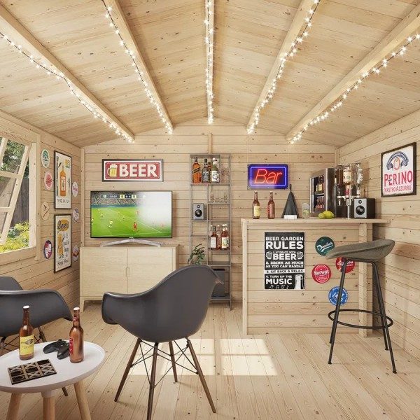 interior of a log cabin shed set up as a garden bar