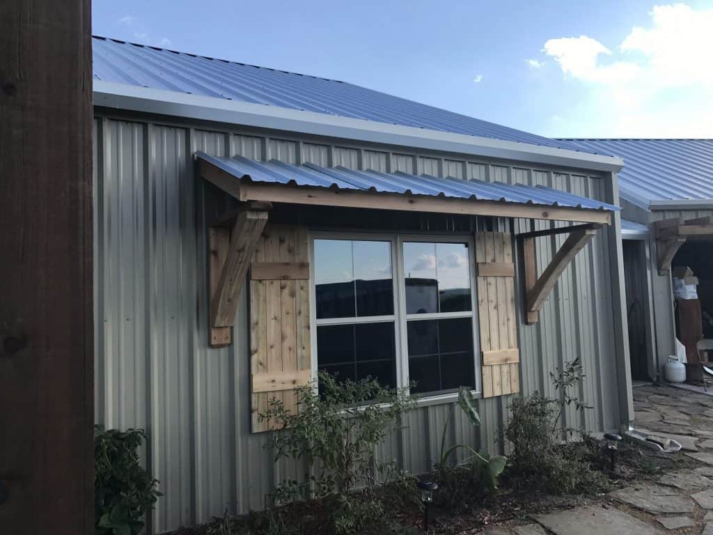 Metal shed with awning for shade
