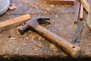 A hammer and tools on wood