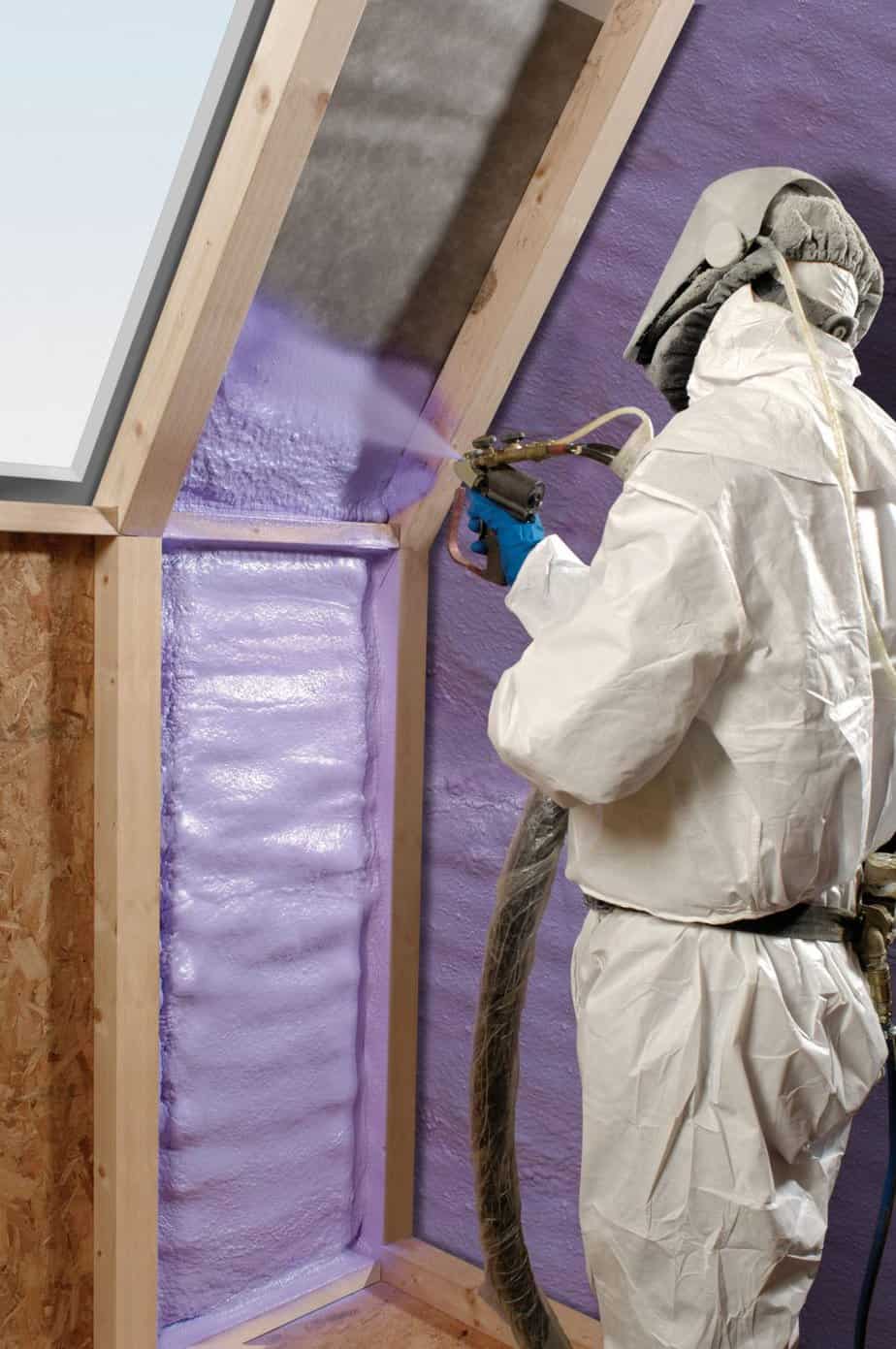 Purple spray foam insulation being applied