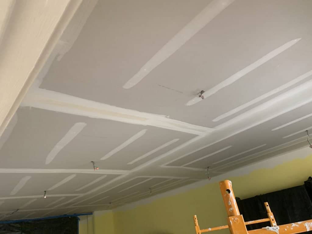 Ceiling with caulk sealing