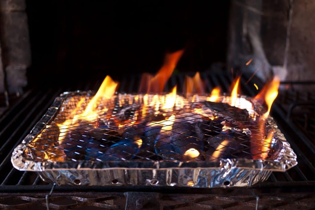 Burning coals on the grill