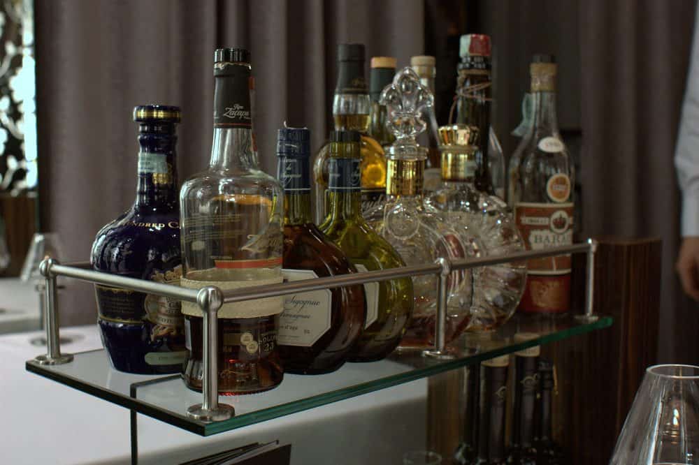 A bar cart full of whiskeys