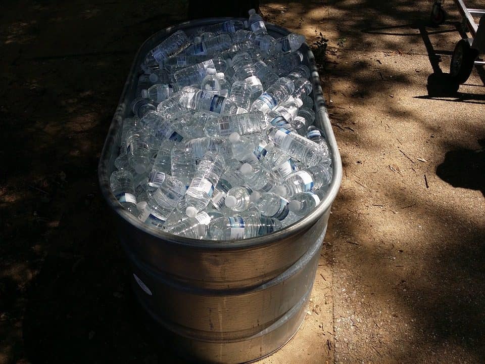 A stock tank filled with ice and bottled water