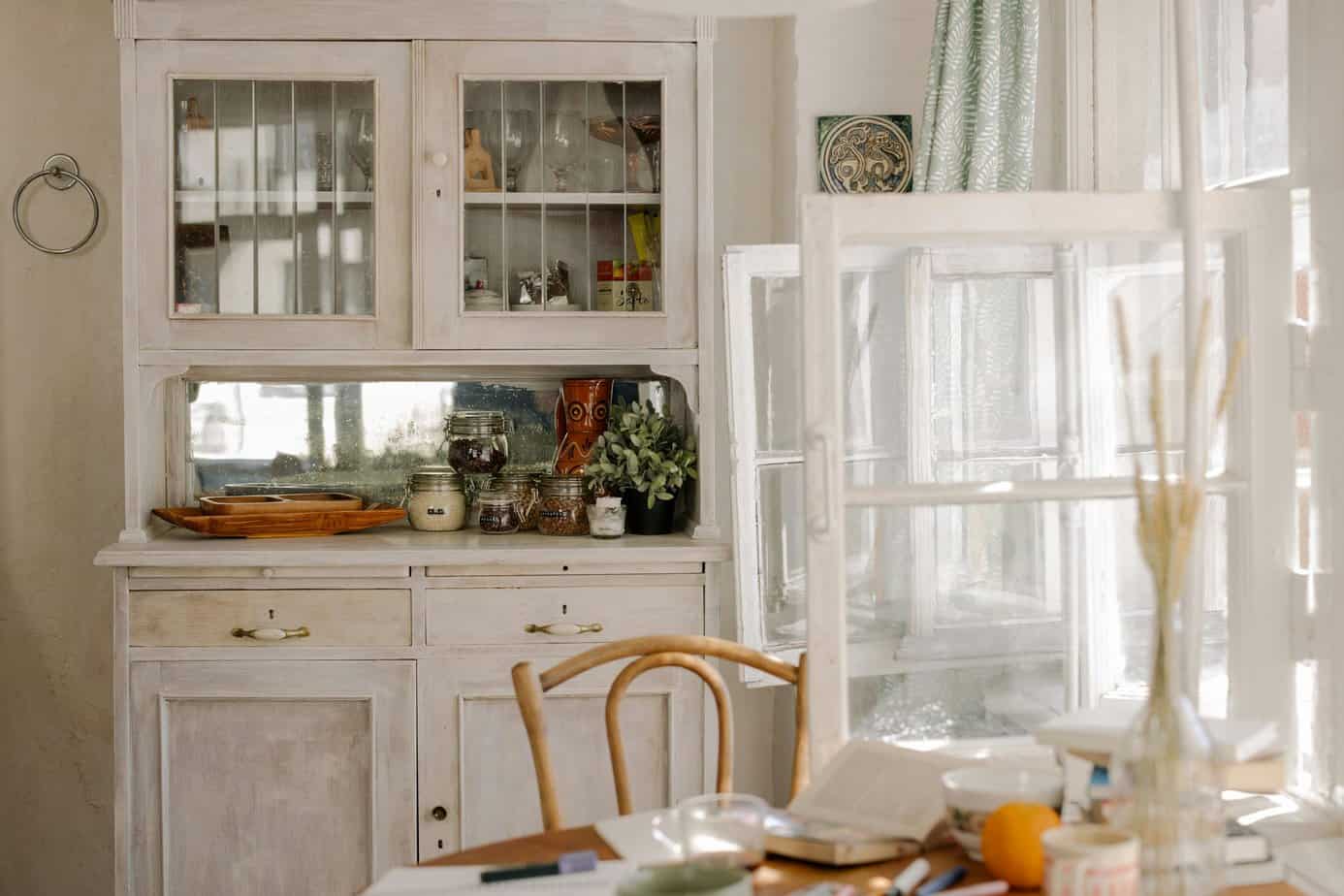 White wooden cabinet near dining table.