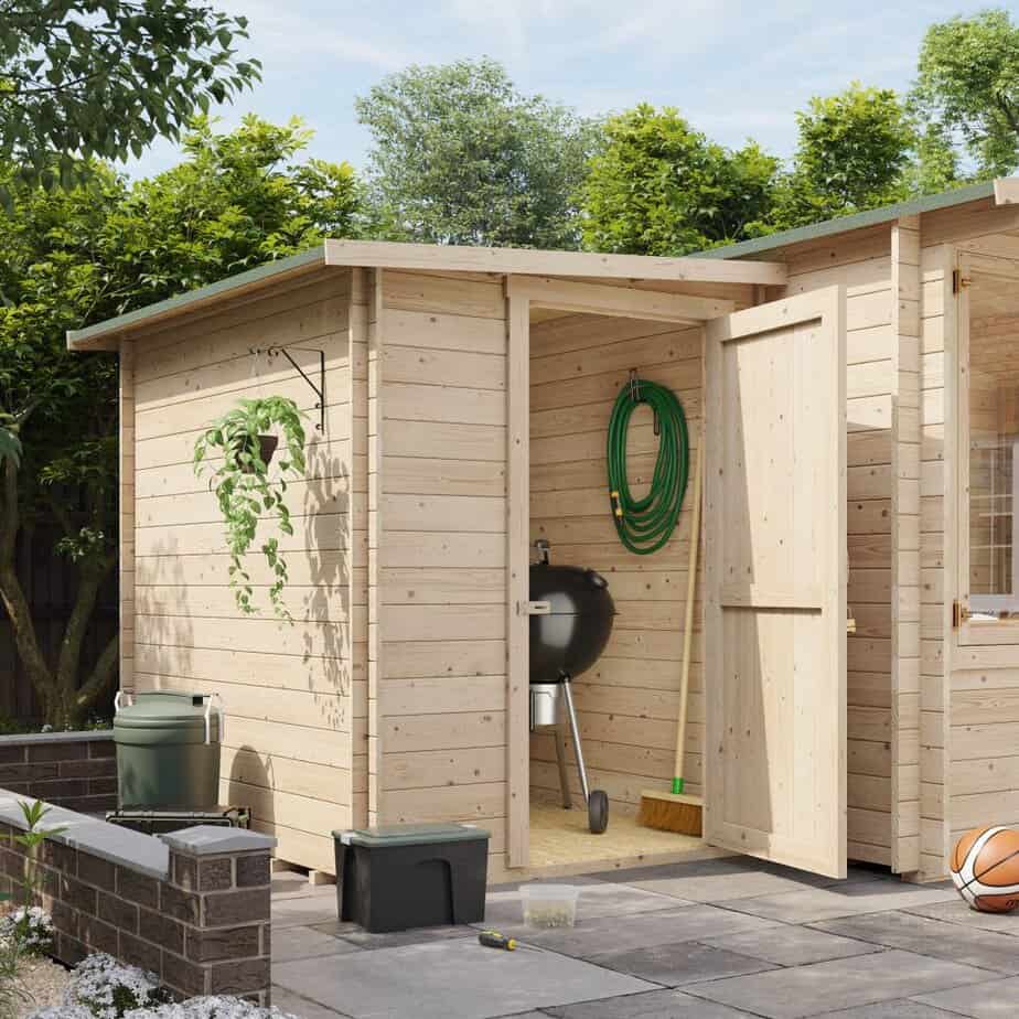 A side storage shed attached to a garden log cabin