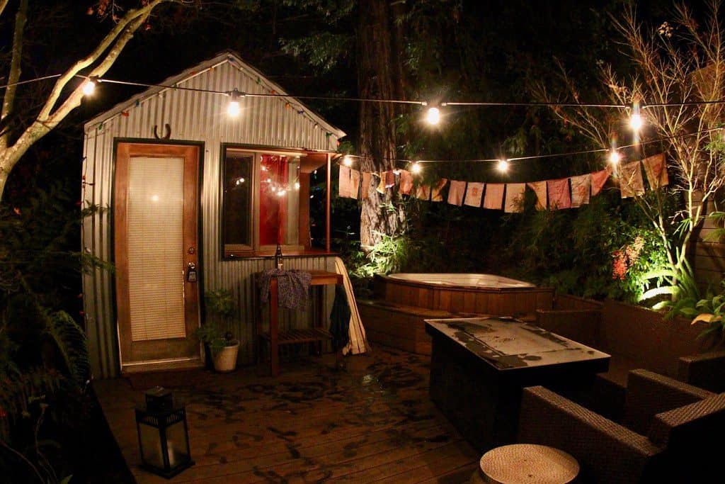 Metal shed airbnb exterior with outdoor seating