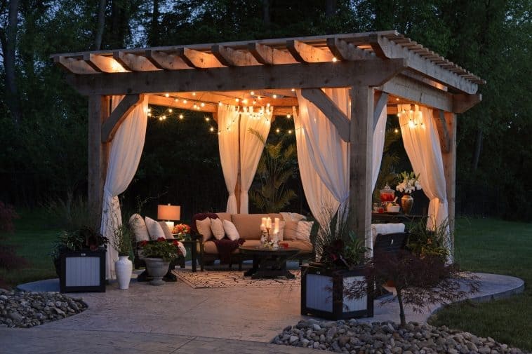 Garden structure with sheer curtains as dividers