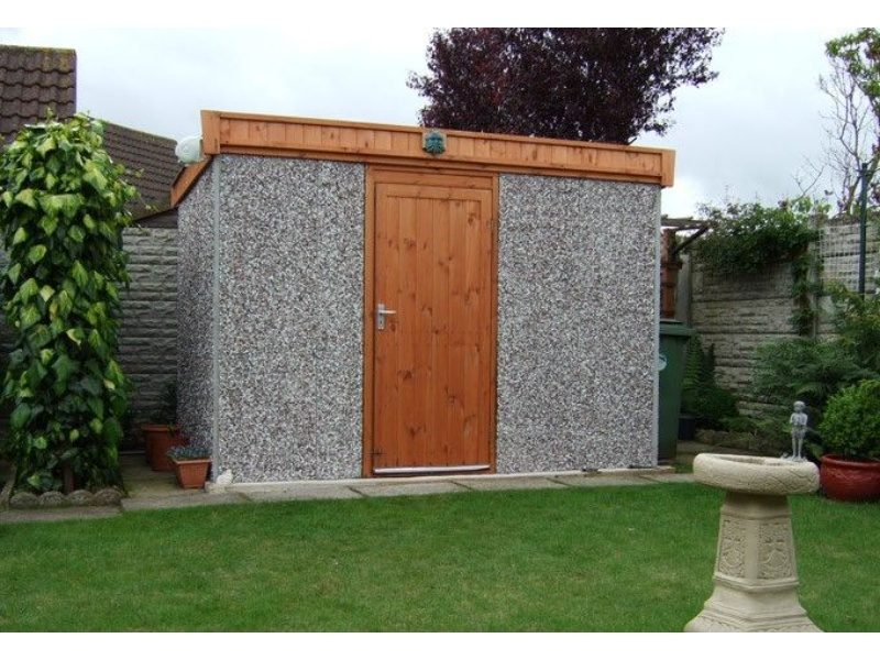 A mini concrete shed with wooden accent