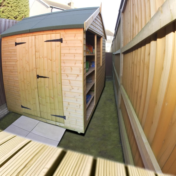 A garden shed with a sloping roof is positioned close to a wooden fence, showing a narrow gap of grass that's less than 1 metre wide between them in a residential backyard.