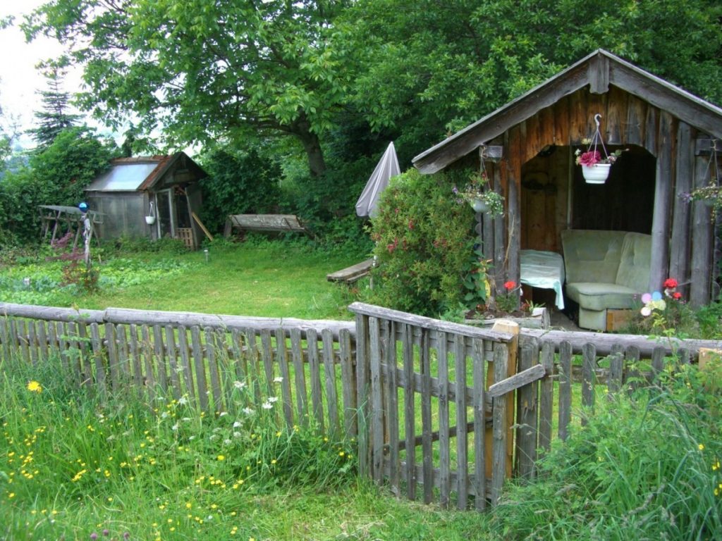 Matching wooden garden buildings and fencing