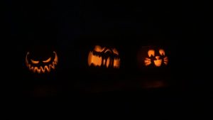 Carved pumpkins in the dark