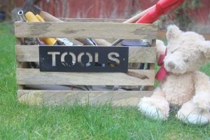 Wooden toolbox with teddy bear