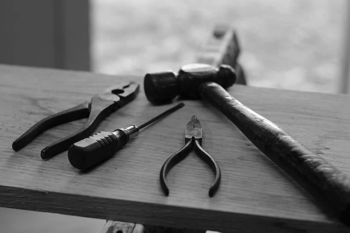 tools on a plan of wood in black and white