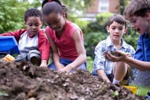 Children playing in mud outside