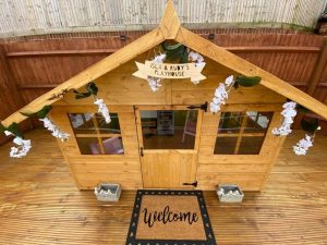 Wooden playhouse front with decorations