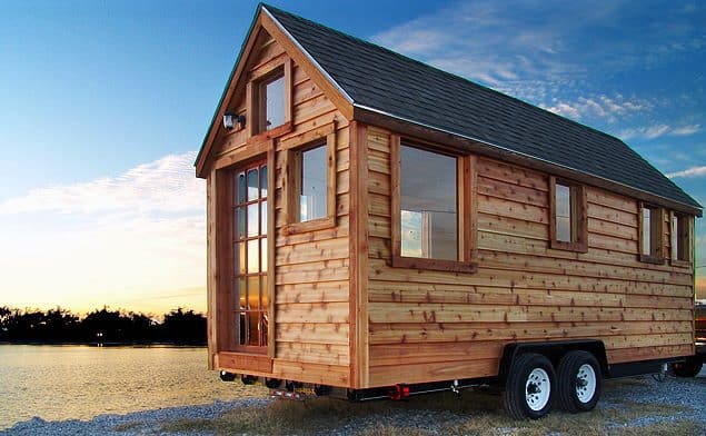 Insulated log cabin used as a portable building for travelling