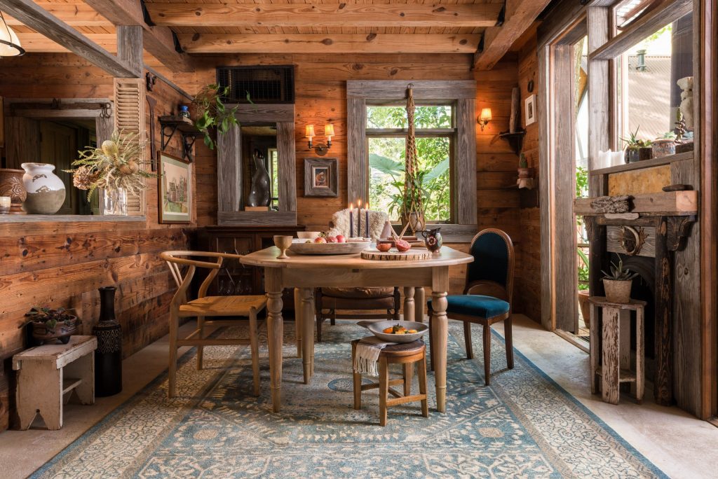 Insulated log cabin decorated with a light rug