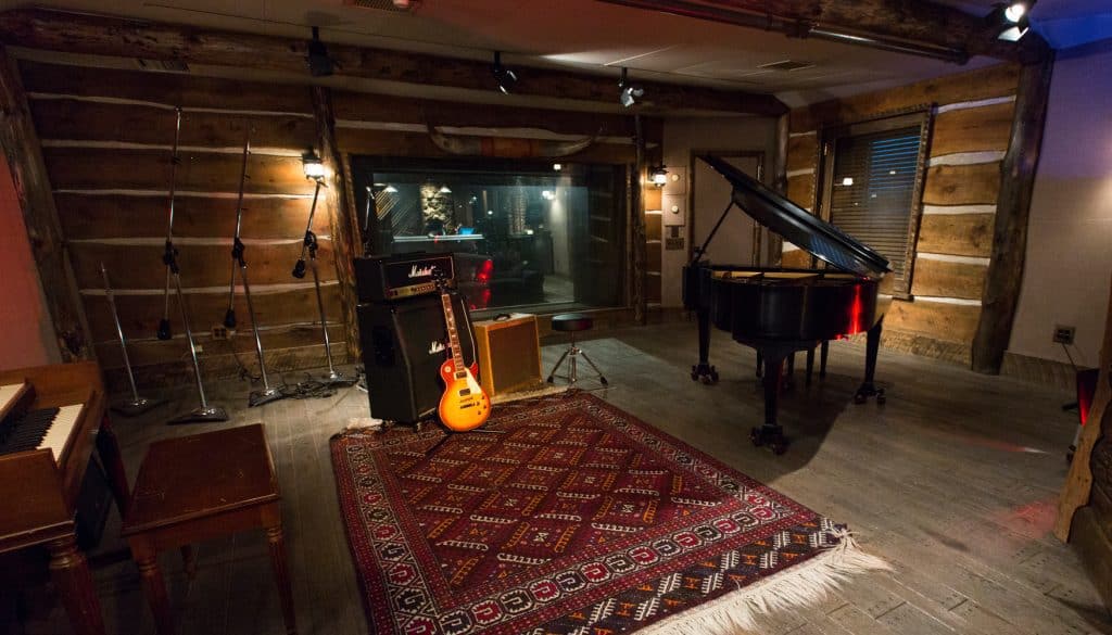 Insulated log cabin transformed into a private music room