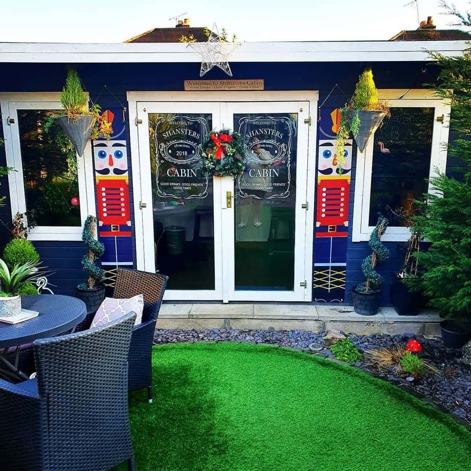 A blue-painted log cabin bar