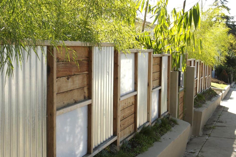 Wood and corrugated metal combination fence