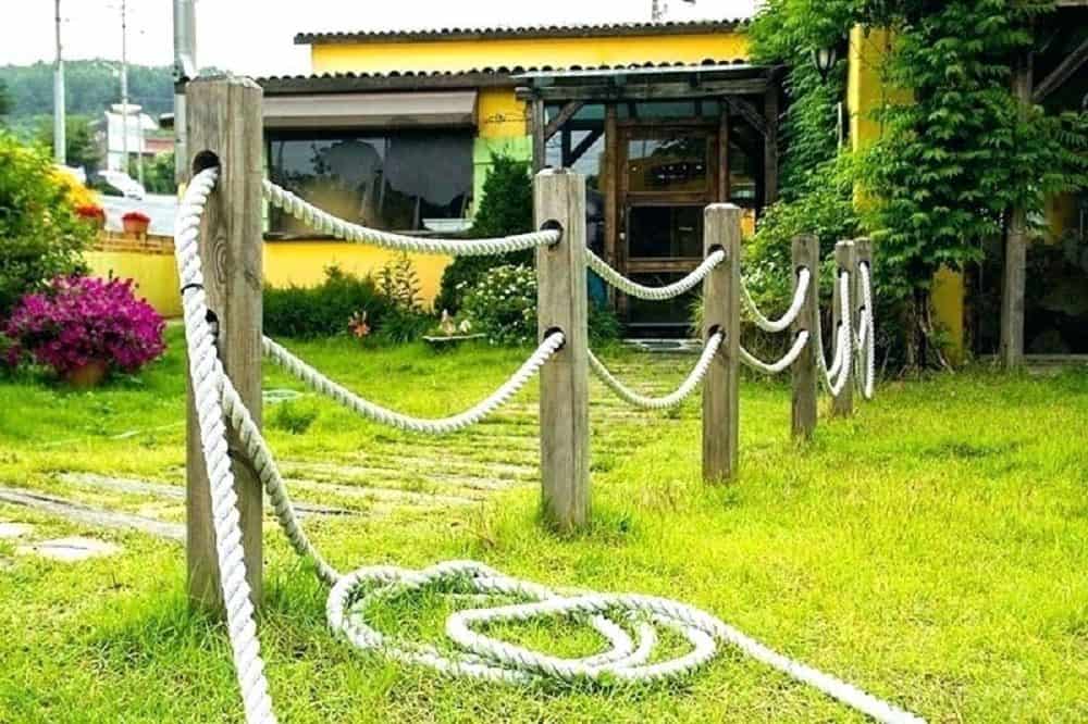Rustic rope garden fence approach