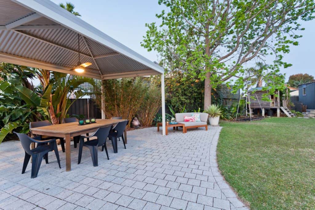 Outdoor kitchen extension featuring a dining set