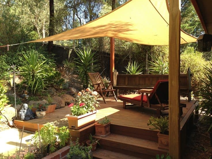 Small garden deck with sail canopy