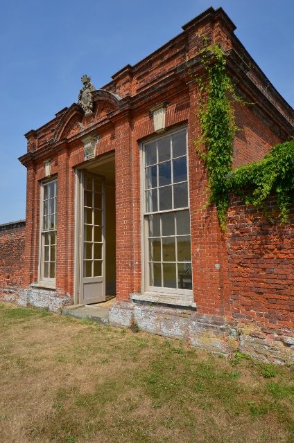 Brick summer house with climbers