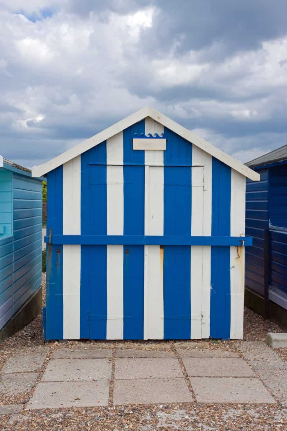 Shipping container shed in blue stripes paint