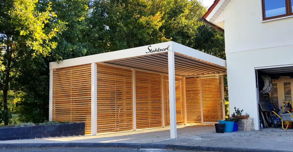 Carport with storage near a house building