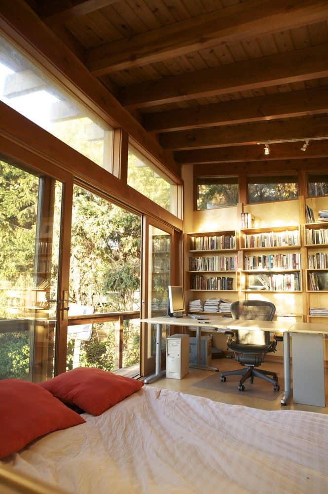 Log cabin bedroom with full glass window