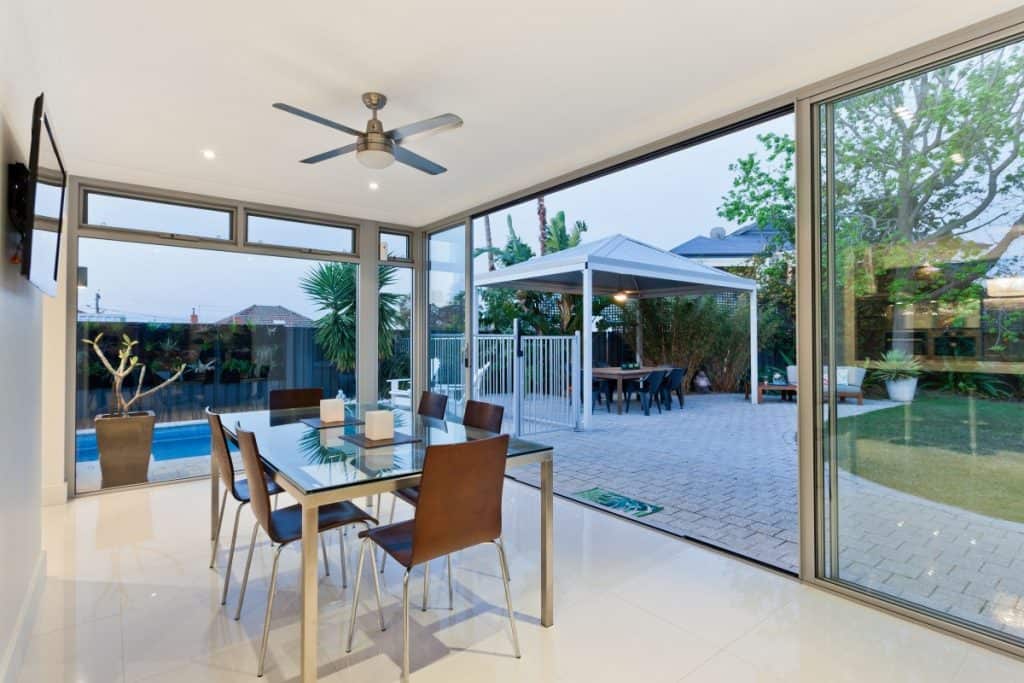 Enclosed outdoor kitchen and dining area
