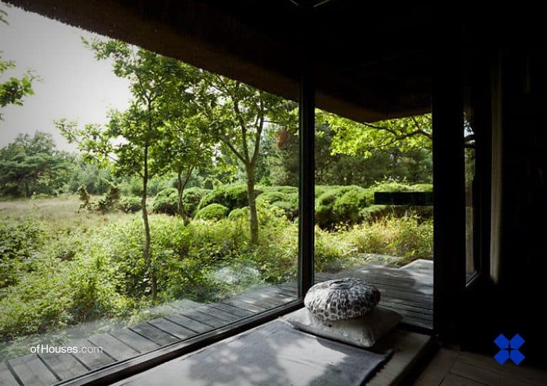 Zen-inspired room interior with a big glass window