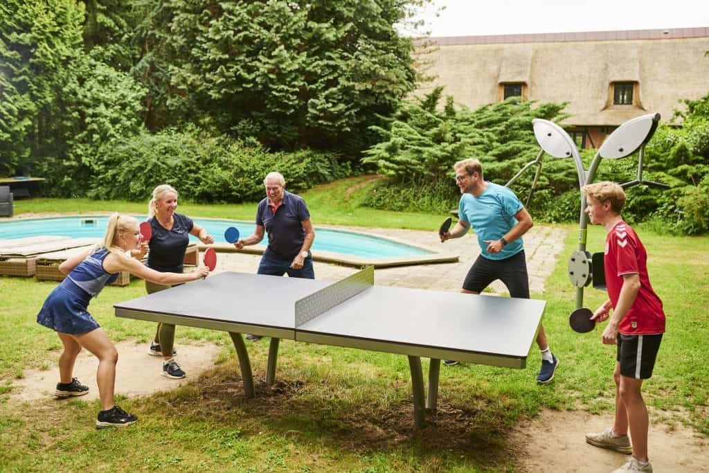Full-sized ping pong table in backyard