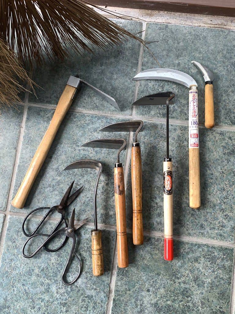 Variety of gardening tools on the floor