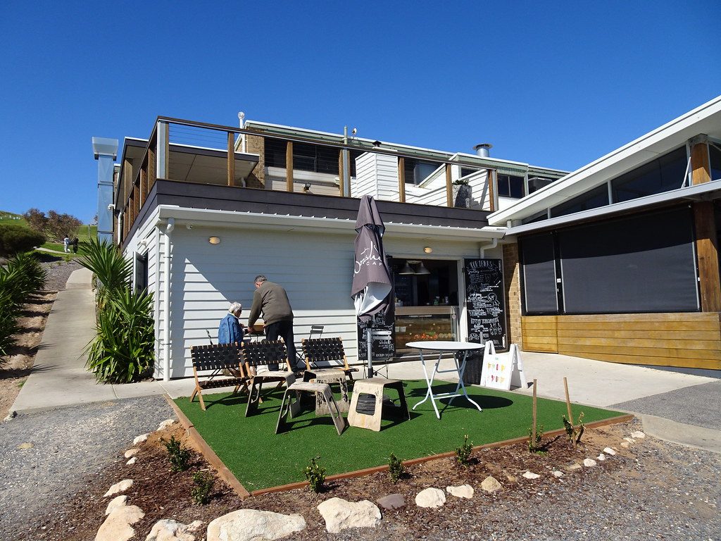 Outdoor cafe seating on artificial lawn