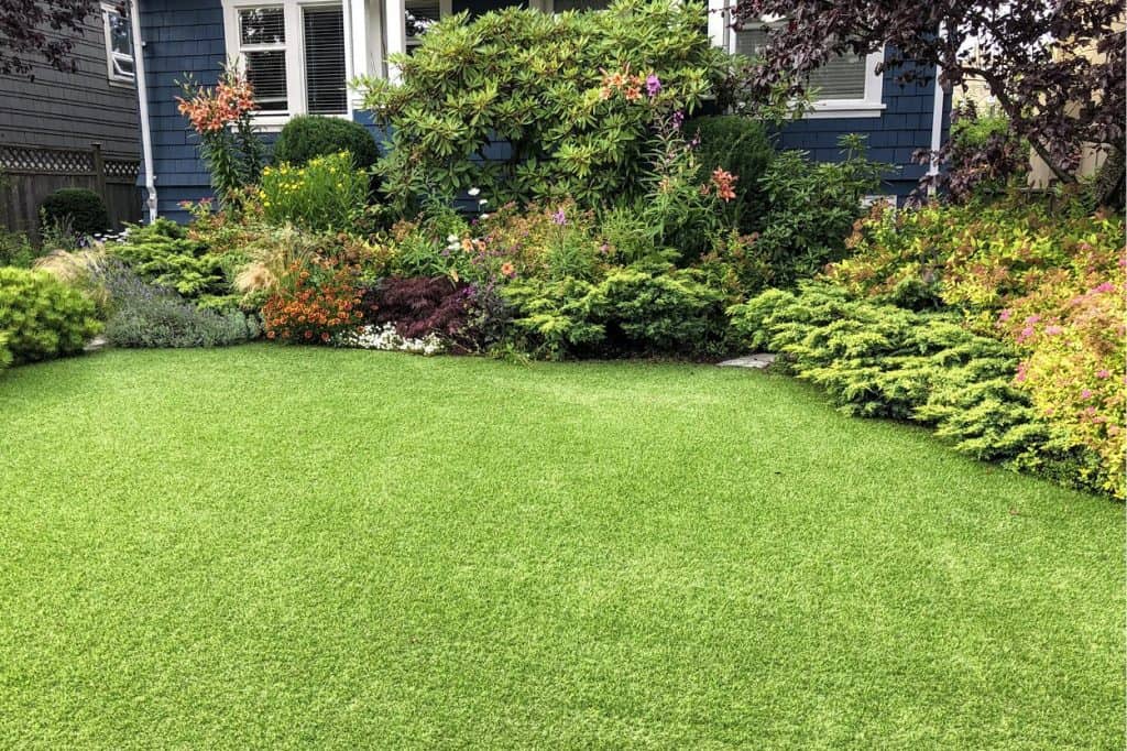Faux turf with mixed genuine greenery