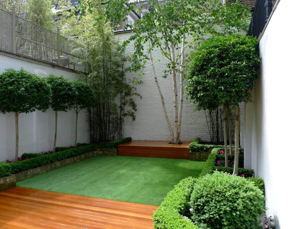 Artificial lawn paired with hardwood decking