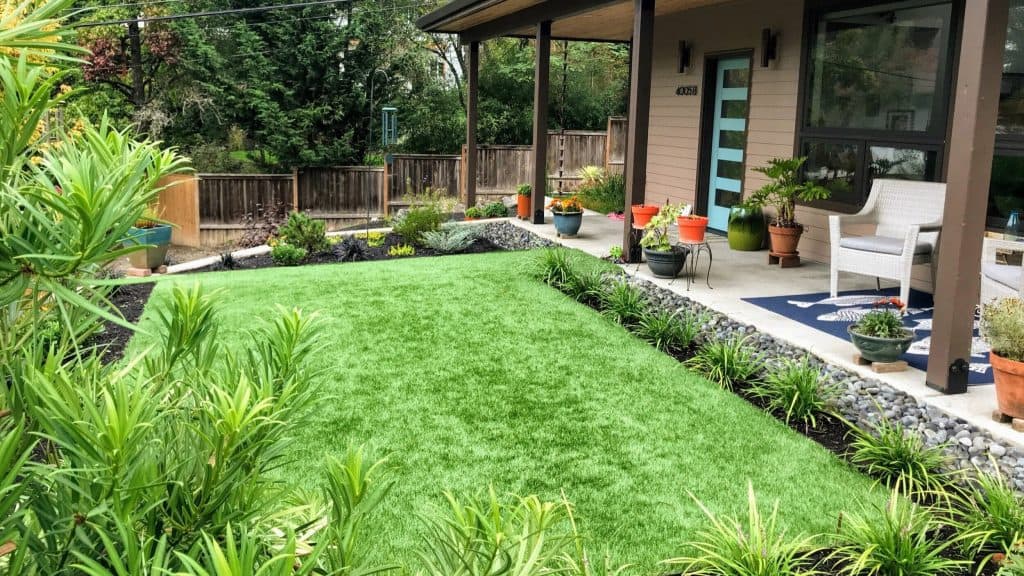Front yard decorated with artificial lawn