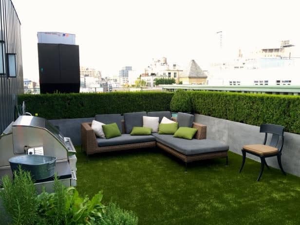 Square and modern rooftop setting with synthetic lawn